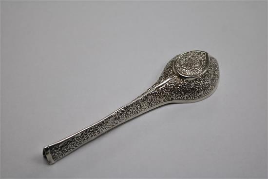 An Indian white metal pouring vessel and a continental apostle spoon.